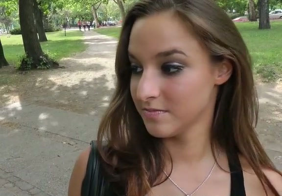 Alluring brunette girl gives awesome blowjob in public park picture