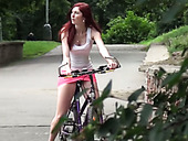 Red haired biker girlie in pink mini skirt pisses on sidewalk