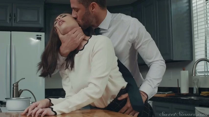 Insatiable husband is fucking sexy wife Casey Calvert in the kitchen pic