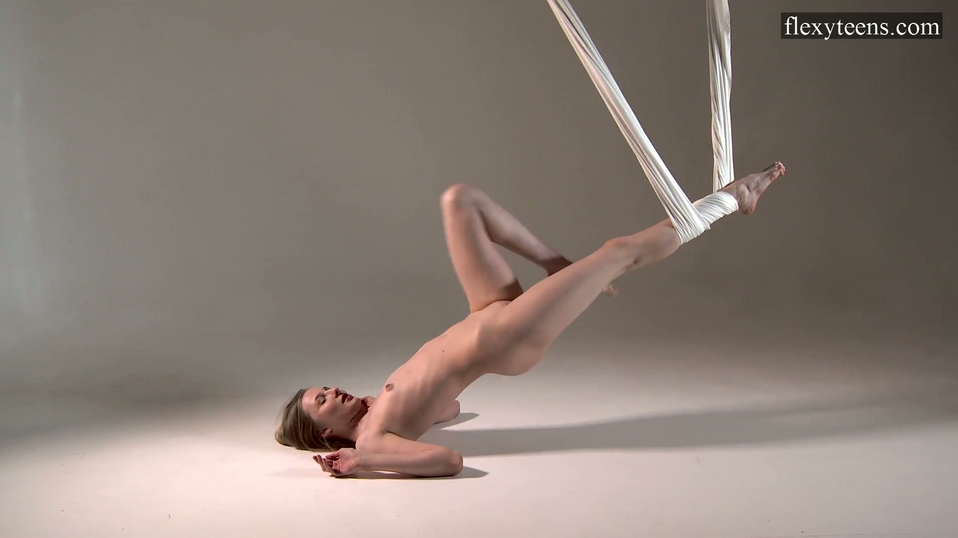 Flexible Russian Gymnast Sofia Zhiraf Gets Naked In The Aerial Hammock Video