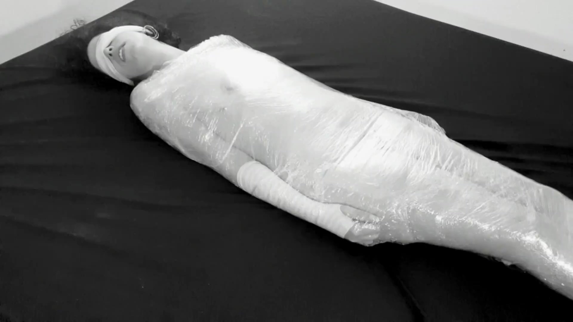 Mummified in plastic wrap girl gets fucked and squirts after fingering pic