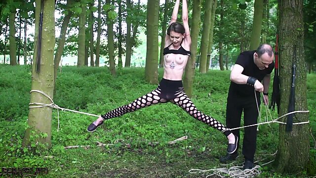 Submissive teen tied up in the woods